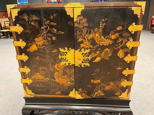 Lot 472 - A Chinoiserie black and gilt lacquered cabinet on stand, 19th century