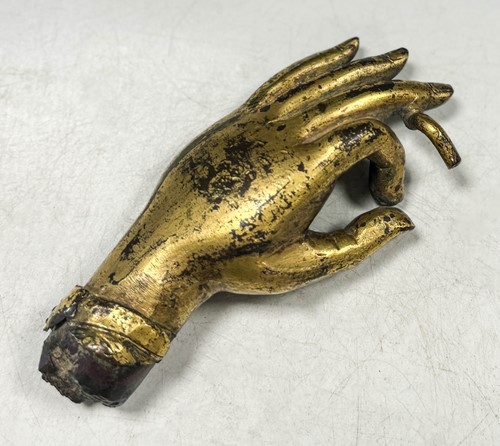 Lot 53 - A Tibetan gilt bronze Buddha hand, heavily cast, 17th/18th century