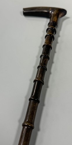 Lot 199 - A sectional walking cane, possibly rhino horn,...