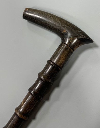 Lot 199 - A sectional walking cane, possibly rhino horn,...