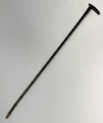 Lot 199 - A sectional walking cane, possibly rhino horn,...