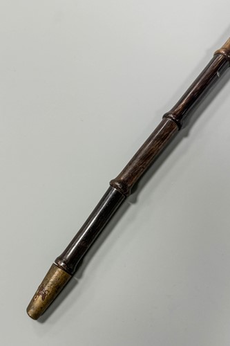 Lot 199 - A sectional walking cane, possibly rhino horn,...