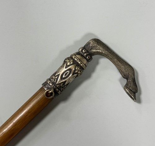 Lot 17 - A rhino horn and silver coloured metal mounted riding crop, late 19th century