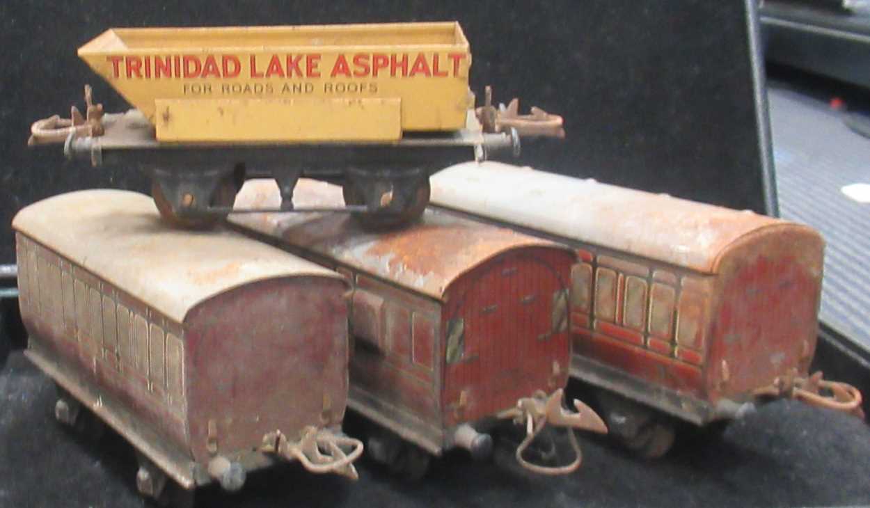 Lot 243 - Three Hornby O gauge tinplate carriages made...
