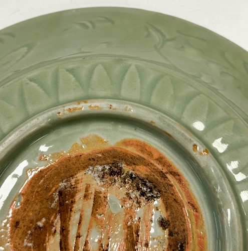 Lot 1 - A Chinese Longquan celadon-glazed dish, Ming Dynasty, 15th/16th century