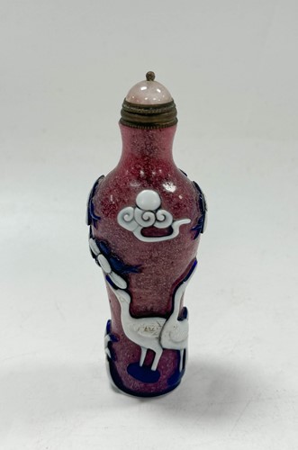 Lot 16 - A Chinese Peking overlay glass snuff bottle, circa 1900