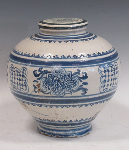 Lot 37 - A blue and white glazed ovoid vase decorated...