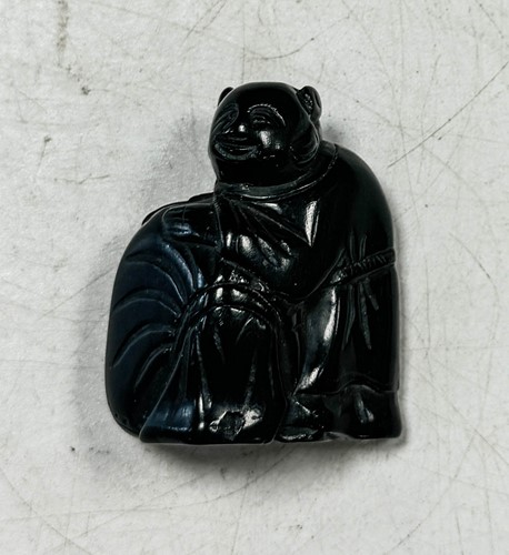 Lot 45 - A Japanese ebonised wood netsuke, late 19th century