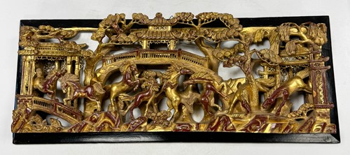 Lot 37 - A Chinese carved and gilt wood Lucky Horses panel, 20th century