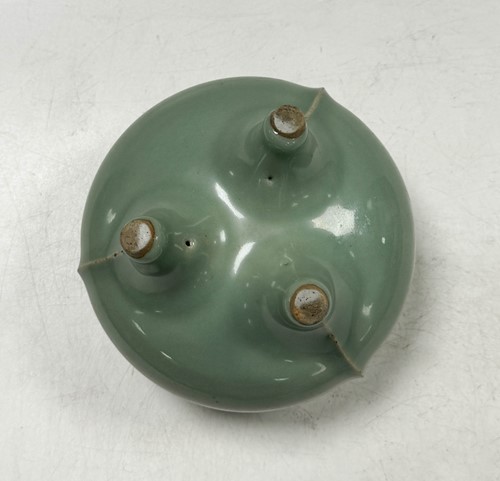 Lot 3 - A Chinese Longquan celadon-glazed tripod censer, South Song Dynasty (1127-1279)