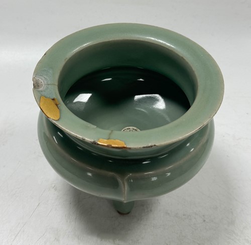 Lot 3 - A Chinese Longquan celadon-glazed tripod censer, South Song Dynasty (1127-1279)