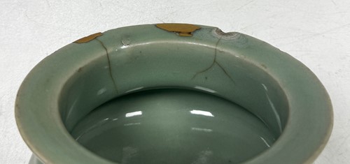 Lot 3 - A Chinese Longquan celadon-glazed tripod censer, South Song Dynasty (1127-1279)