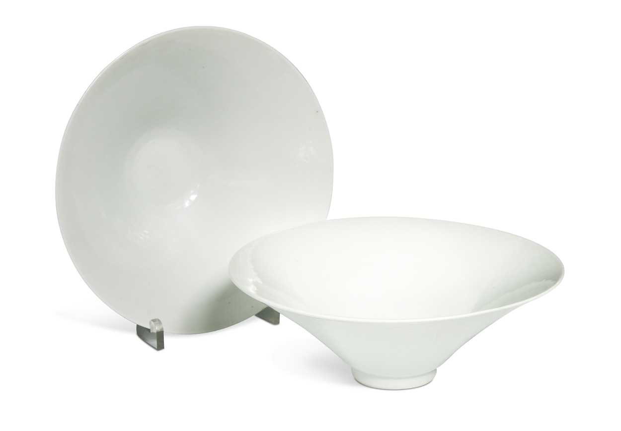Lot 2 - A pair of Chinese white glazed "hidden decoration" floral bowls, 18th century