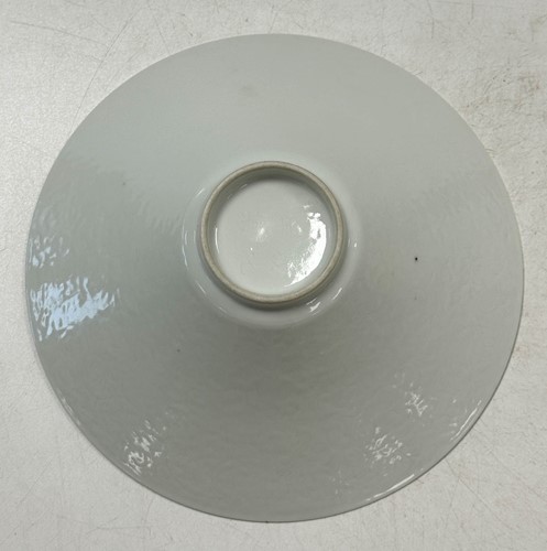 Lot 2 - A pair of Chinese white glazed "hidden decoration" floral bowls, 18th century