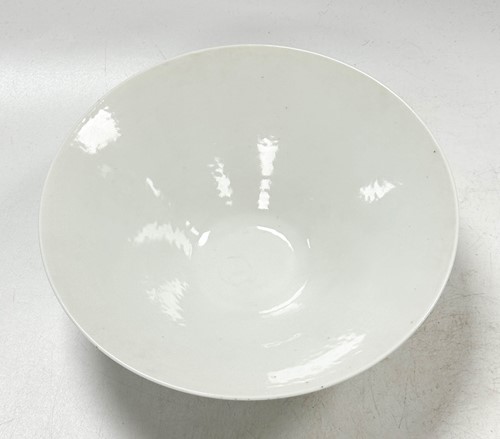 Lot 2 - A pair of Chinese white glazed "hidden decoration" floral bowls, 18th century