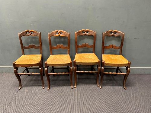 Lot 367 - A set of four Continental beech framed dining...