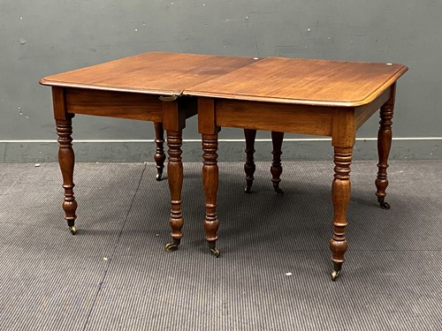 Lot 638 - A 19th century mahogany dining table in two...