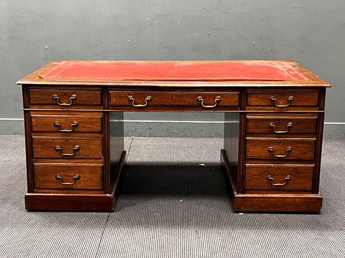 Lot 639 - An Edwardian mahogany pedestal desk with nine...