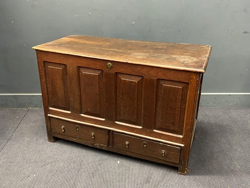 Lot 393 - An 18th century oak mule chest, the hinged top...