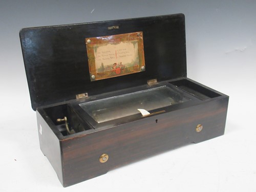 Lot 57 - A 19th century Swiss musical box, the top...