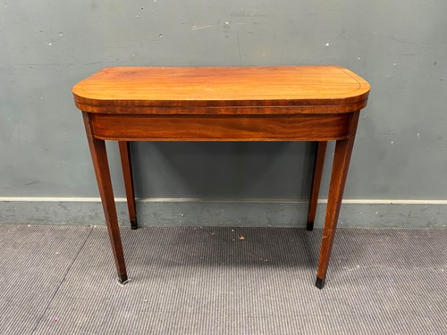 Lot 419 - A 19th century mahogany card table on tapered...