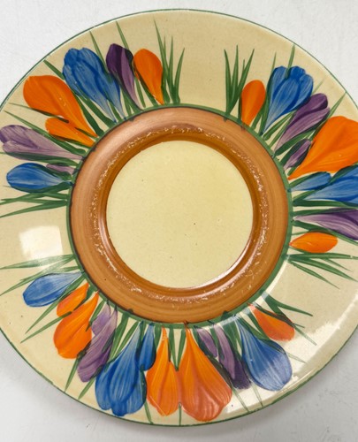 Lot 33 - A Clarice Cliff 'Crocus' pattern conical tea-for-two set
