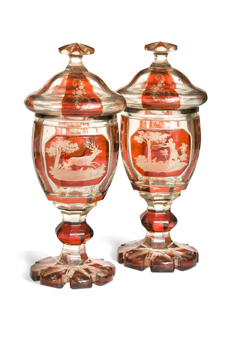 Lot 340 - A pair of Bohemian ruby flash cut goblets and covers, 19th century