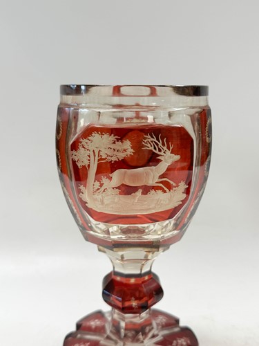 Lot 340 - A pair of Bohemian ruby flash cut goblets and covers, 19th century