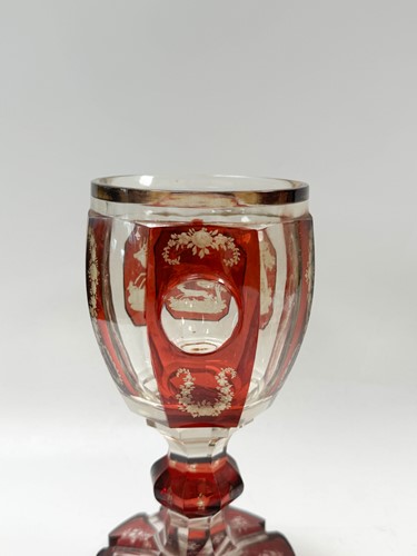 Lot 340 - A pair of Bohemian ruby flash cut goblets and covers, 19th century