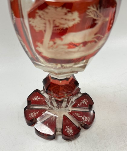 Lot 340 - A pair of Bohemian ruby flash cut goblets and covers, 19th century