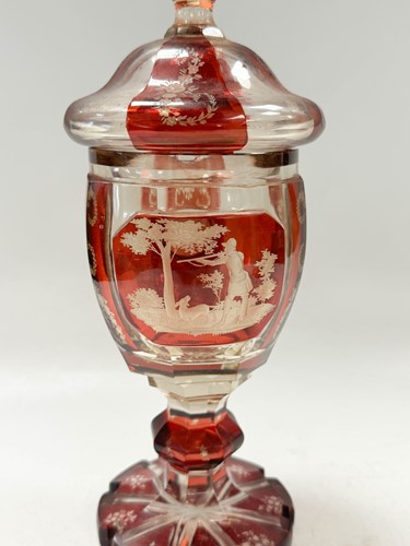 Lot 340 - A pair of Bohemian ruby flash cut goblets and covers, 19th century