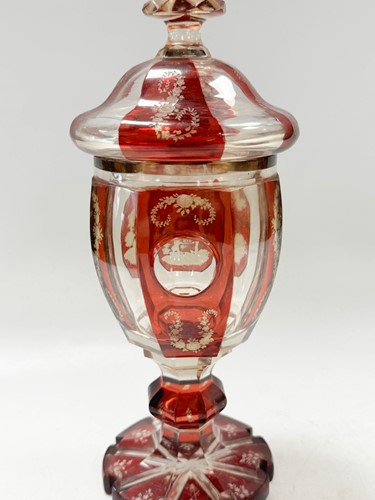 Lot 340 - A pair of Bohemian ruby flash cut goblets and covers, 19th century