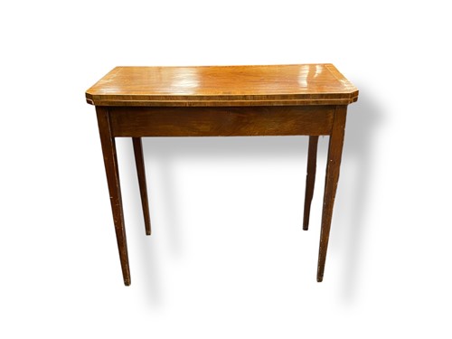 Lot 661 - A George III mahogany card table the canted...