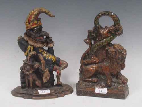 Lot 88 - Two cast doorstops, one cast brass (punch) one...