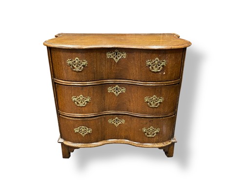 Lot 663 - A Dutch mahogany serpentine side chest of...