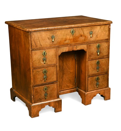 Lot 300 - A Queen Anne walnut veneered kneehole desk