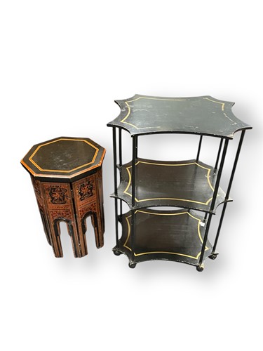 Lot 611 - A stylish ebonised three tier etagere, with...