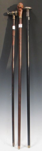 Lot 165 - Three walking sticks, to include a white metal...