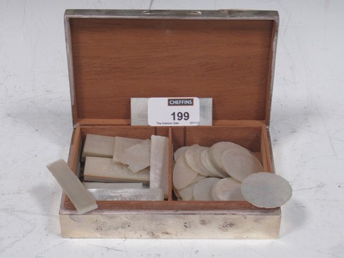 Lot 199 - A silver cigarette box containing mother of...