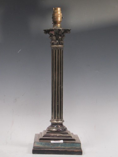 Lot 214 - A silver plated table lamp, modelled as a...