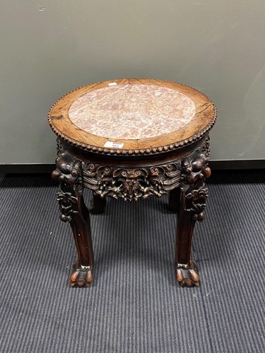 Lot 491 - An early 20th century low Chinese hardwood urn...