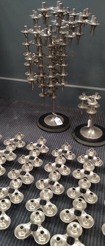 Lot 145 - Fritz Nagel, a pair of modular polished metal candlesticks, mid-20th century