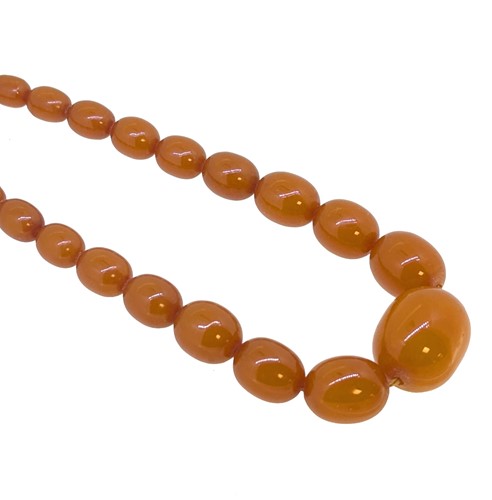 Lot 65 - A graduated amber bead necklace