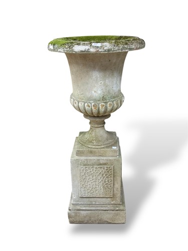 Lot 859 - A reconstituted stone garden urn and...