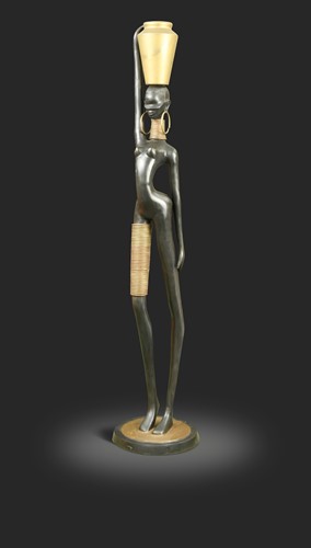 Lot 83 - In the manner of Karl Hagenauer, a large patinated metal figure of a stylised African water-carrier