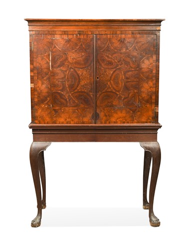Lot 461 - An oyster veneered two door cabinet on stand, 17th century and later