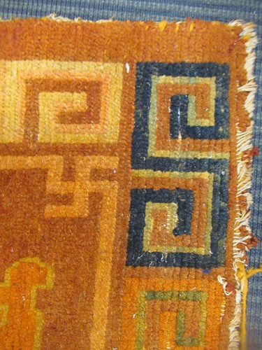 Lot 871 - A Tibetan wool rug, 20th century, the dark...