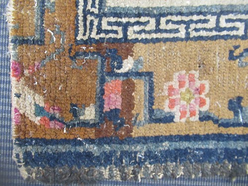 Lot 871 - A Tibetan wool rug, 20th century, the dark...