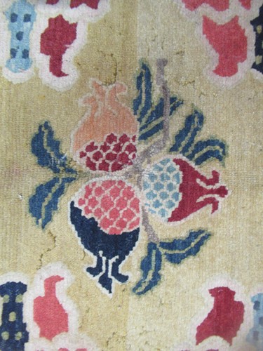 Lot 871 - A Tibetan wool rug, 20th century, the dark...