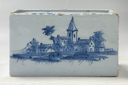 Lot 285 - A Delft blue and white flower brick, circa 1750